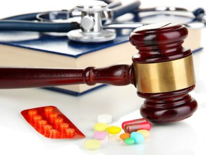 Medicine law concept. Gavel and pills close up